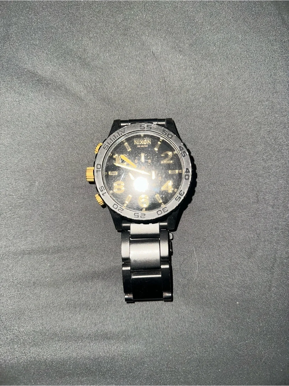 Nixon Men’s Black and Gold Chronograph Watch